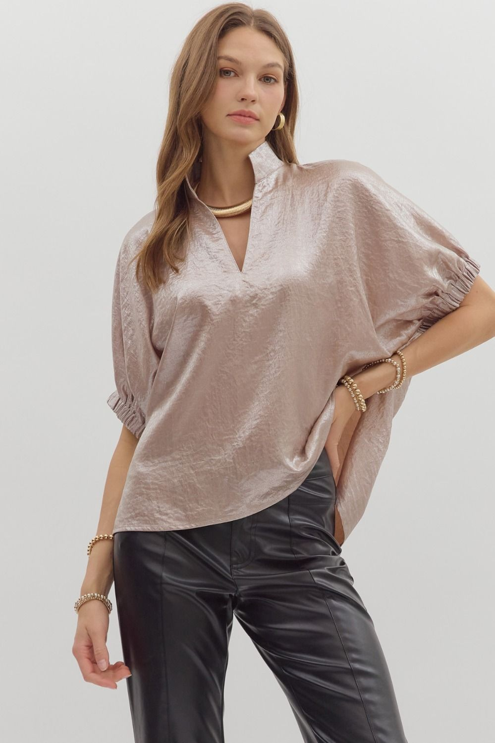 Metallic V-neck band collar short dolman sleeve top. Unlined. Woven. Non-sheer. Lightweight.